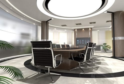 Round table in an upscale office conference room.