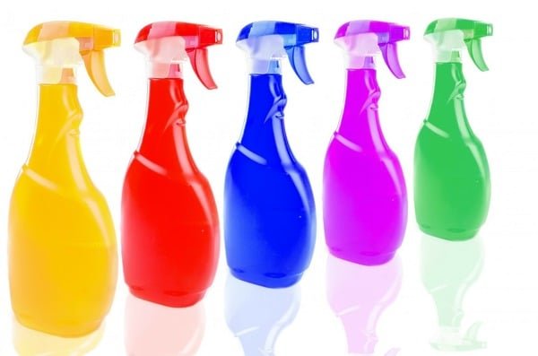 Cleaning products in multi-colored spray bottles