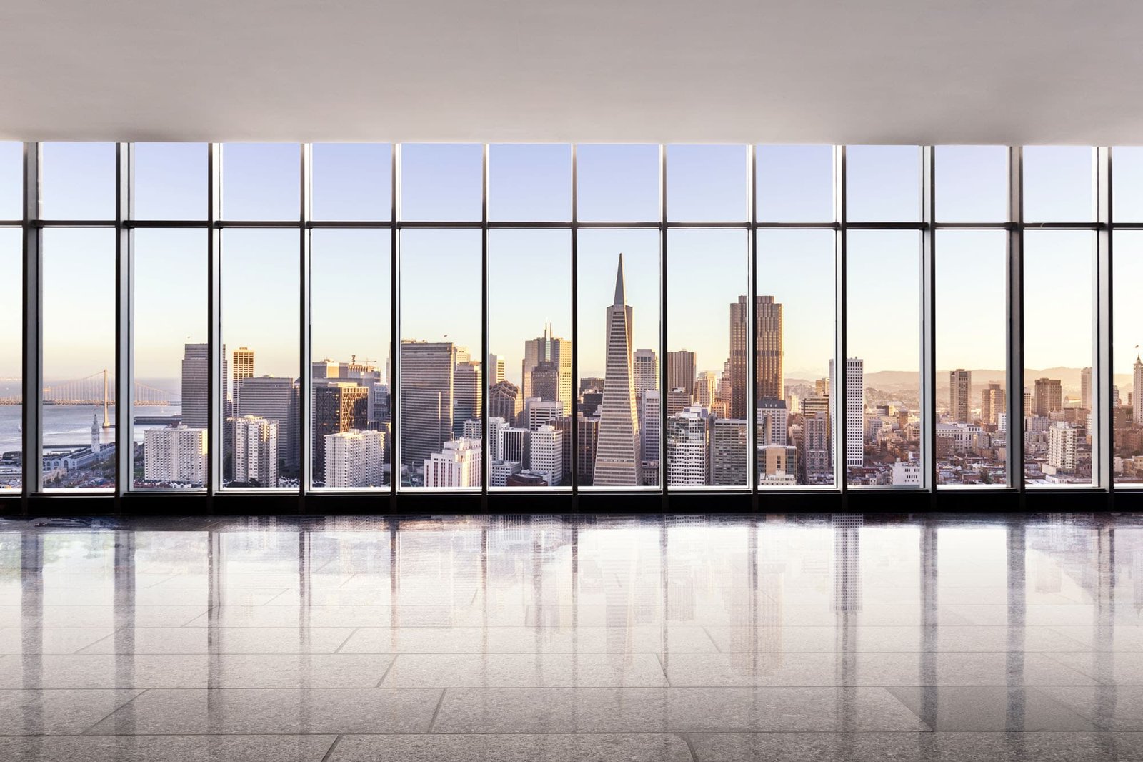 Window view of the skyline of san francisco at sunrise.
