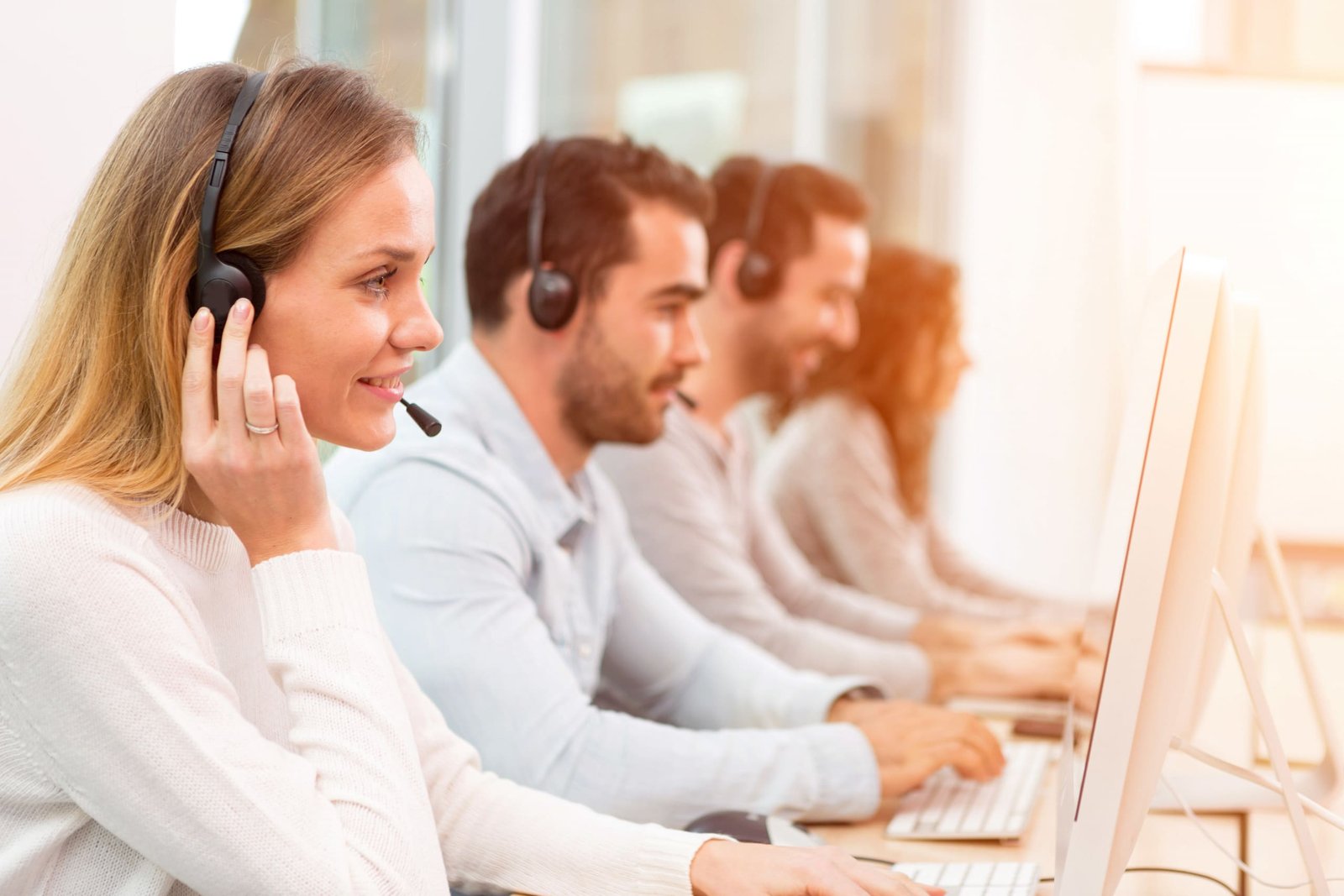 Image of a young attractive woman working in a call center.