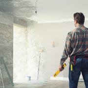 Handyman remodeling a room.