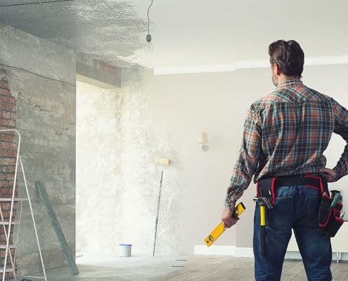 Handyman remodeling a room.