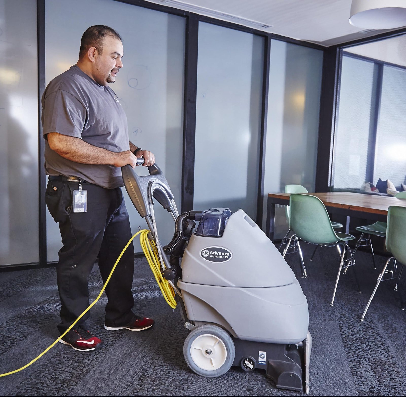 man cleaning carpet