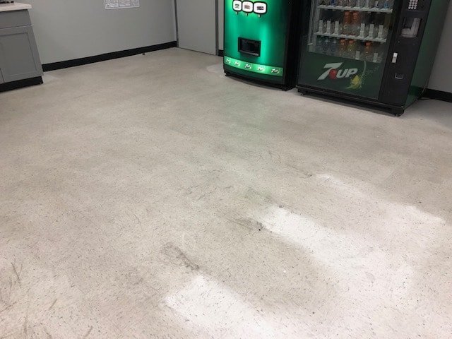 Before photo of a dirty, unwaxed floor.